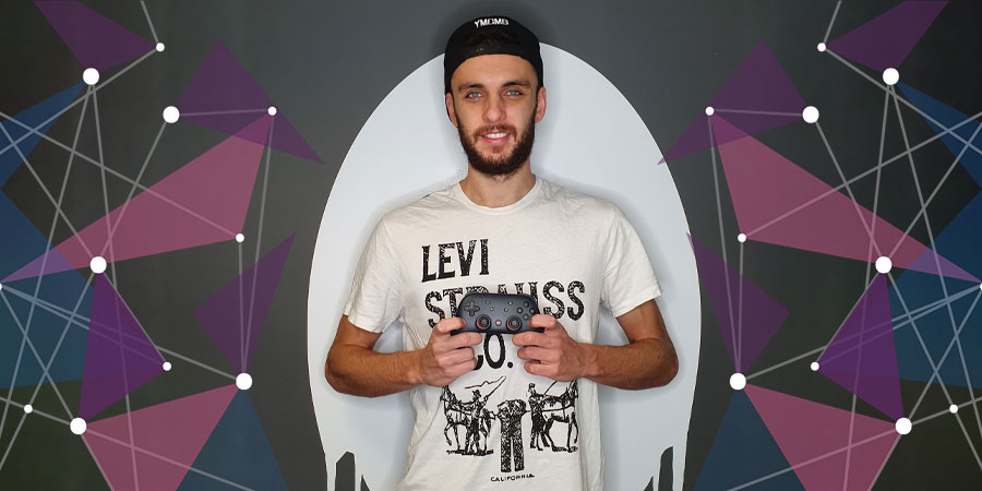 DJ Oli in front of Ghost logo